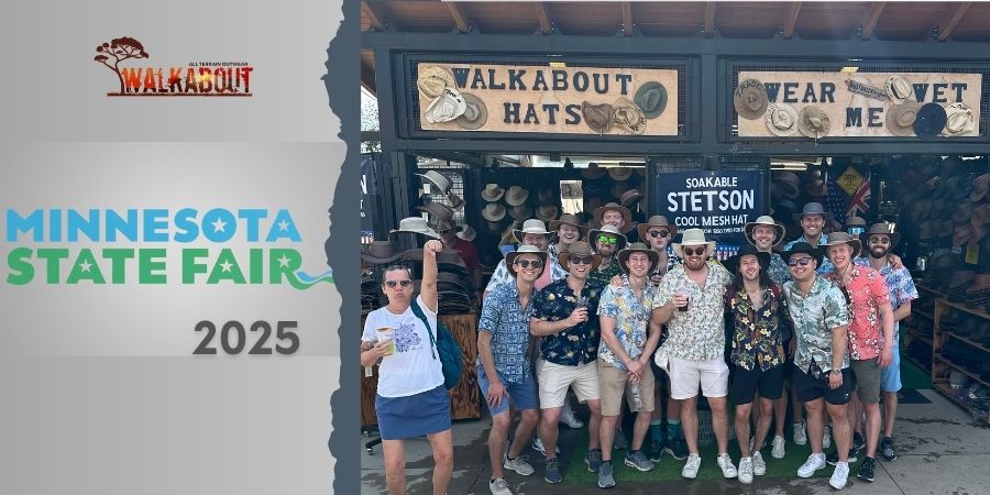 Group of people posing in front of a 'Walkabout Hats' stand at the Minnesota State Fair.